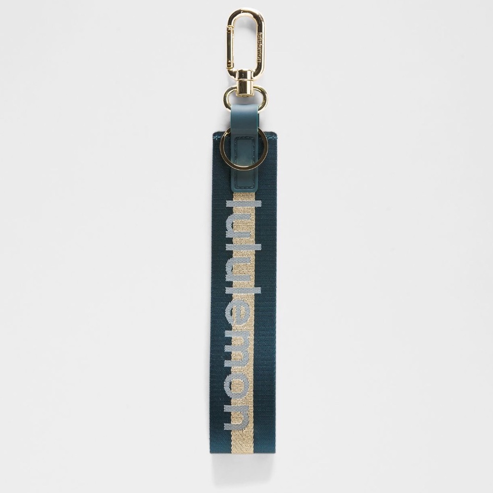 Lululemon | never lost keychain | warp teal wordmark